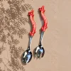 Red coral salad servers